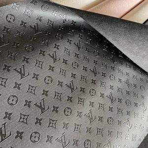 black louis vuitton fabric with embossed LV monogram canvas pattern