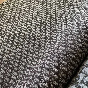 dark brown patterned jacquard dior fabric with light gray background