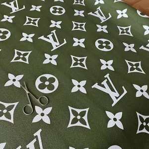 green louis vuitton leather fabric with big white LV monogram pattern