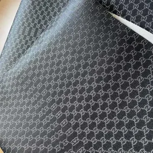 black gucci fabric with silver glittered patterns