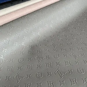 gray louis vuitton vinyl fabric with embossed LV pattern