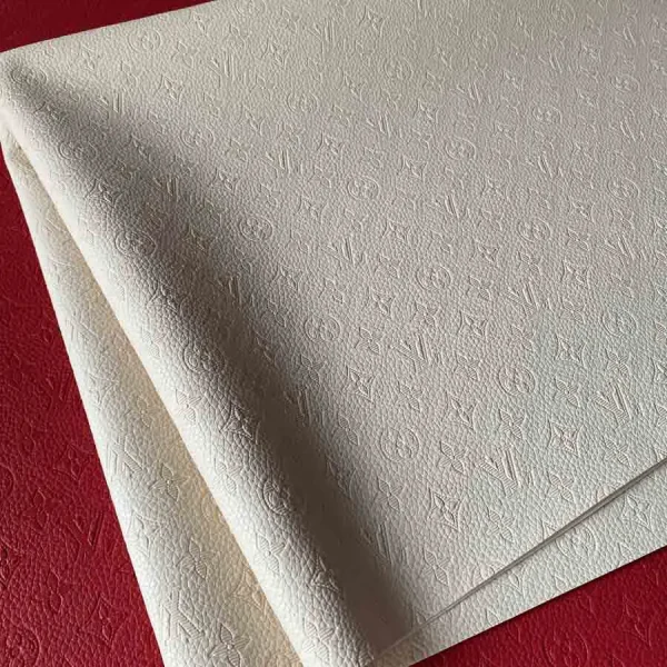louis vuitton dirty white leather fabric used for empreinte bags: hot press pattern