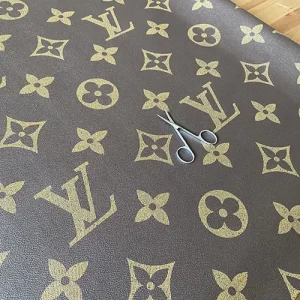 louis vuitton brown leather fabric with big dirty gold letters
