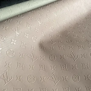 louis vuitton pink vinyl with embossed monogram patterns